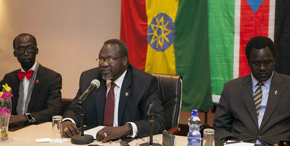 Riek Machar (centre),  at a press conference at the Radisson Hotel in Addis Ababa, Ethiopia, on July 9, 2014. He is flanked by Ezekiel Lol Gatkuoth (right), and De-Mabior Garang. Igad has warned Machar team of sanctions for skipping peace talks. AFP PHOTO | ZACHARIAS ABUBEKER 